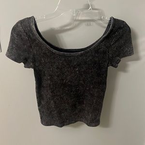 Cropped short sleeve wide necked dark gray top.